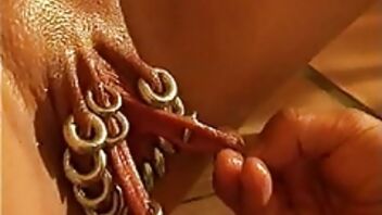 Pierced vagina is getting fisted in extremely hardcore way