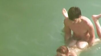 Wild young lovers are having sensational sex in the water