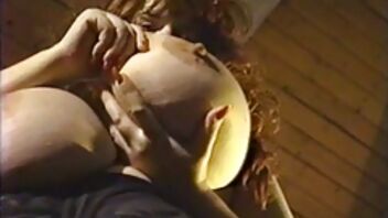 Chubby woman is touching her extremely huge tits wildly